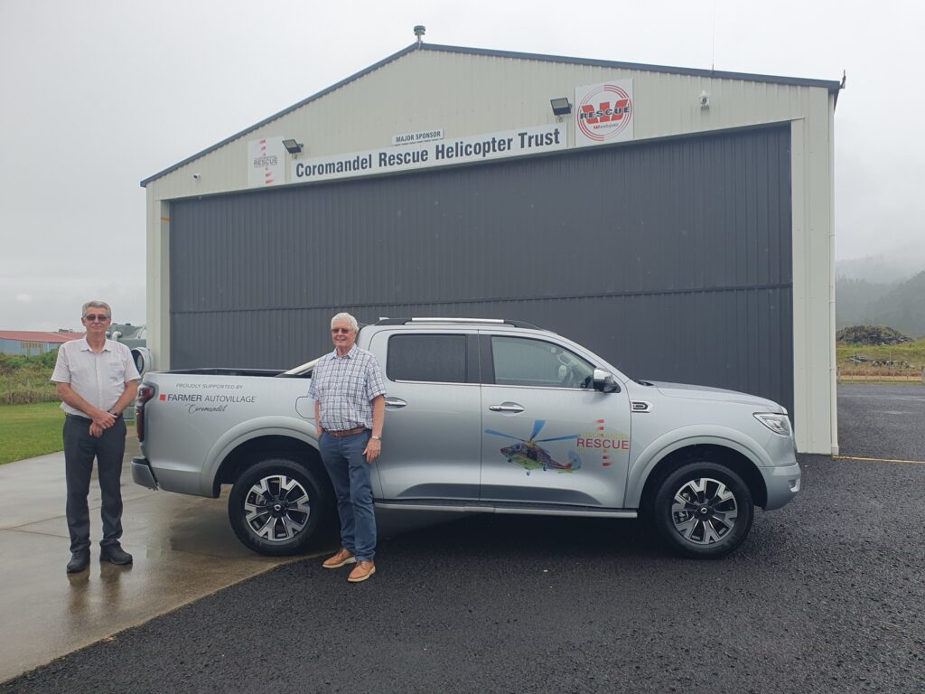 John Stepheson and Mike Farmer at the Whitianga helicopter rescue base with the vehicle provided for crew by Farmers Auto Village